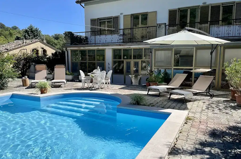 Exterior of the La Vita Sukha event venue with private pool and sun-lounger detail